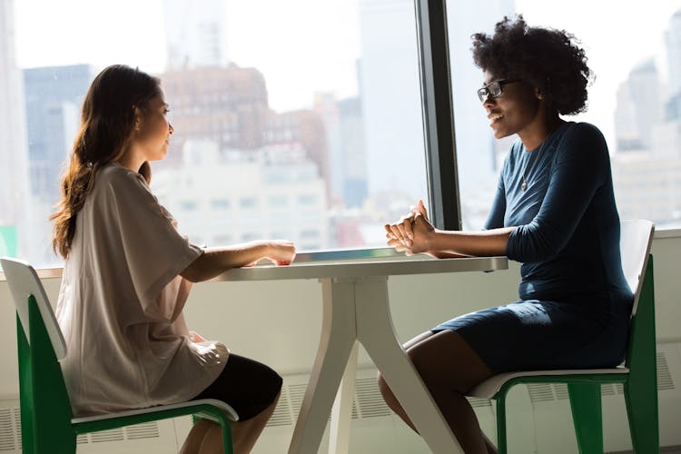 Two young girls discussing how therapy plays vital role in treating ADHD