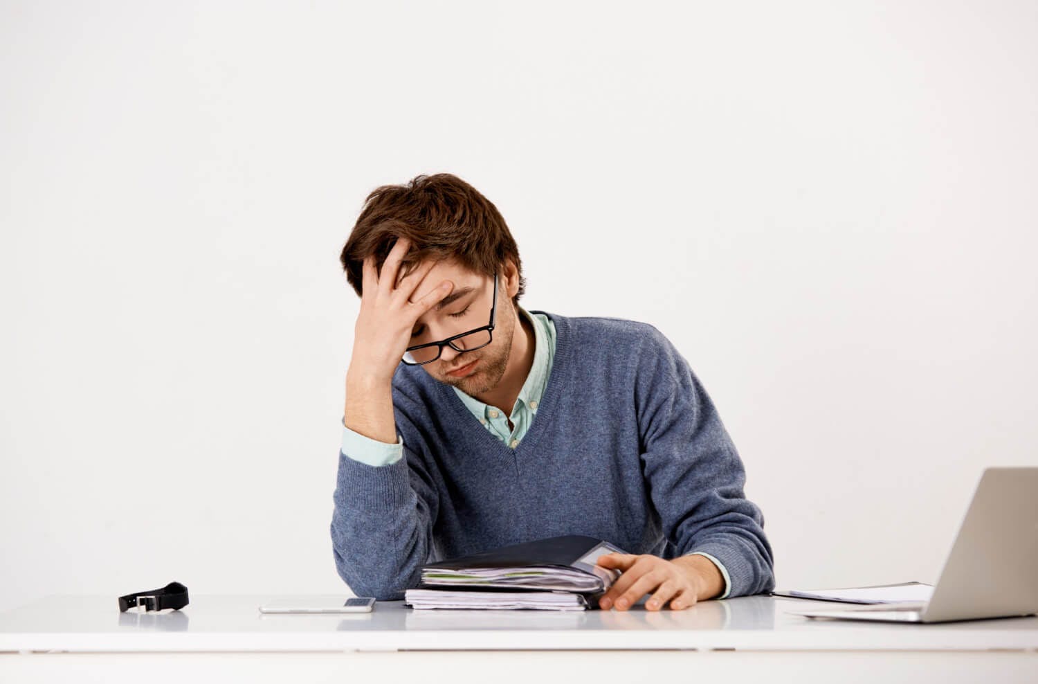 Tired male office worker, sighing uneasy - Fatigue and depression