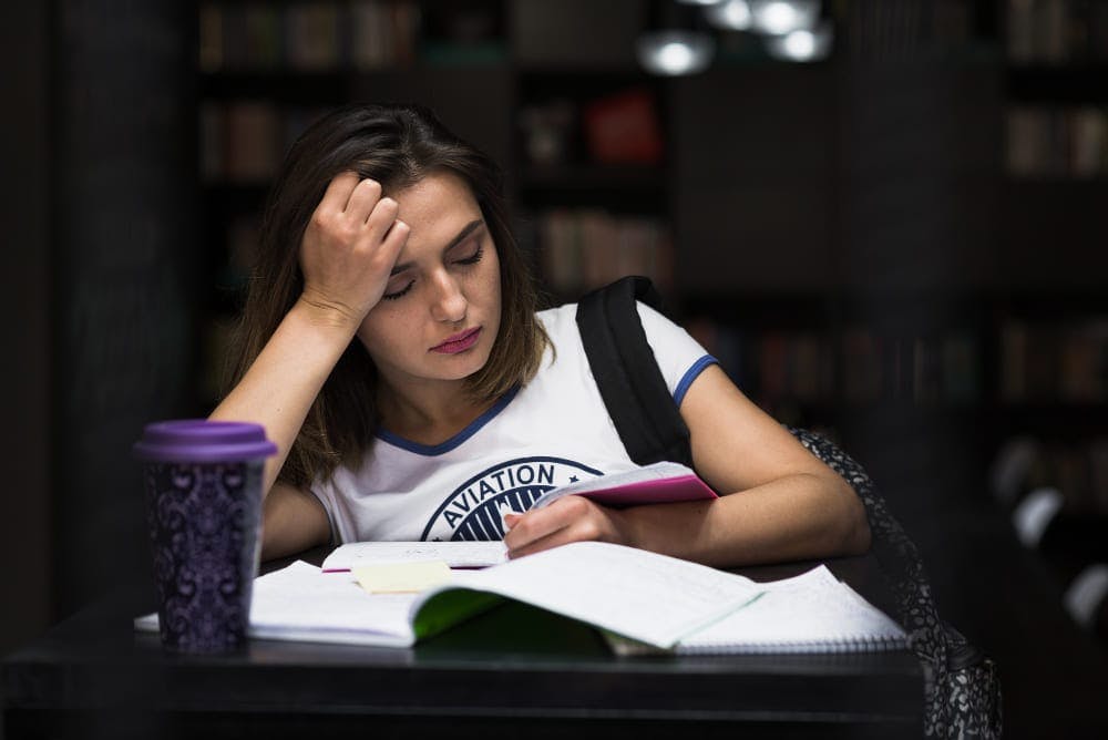 girl focusing on studying when depressed.