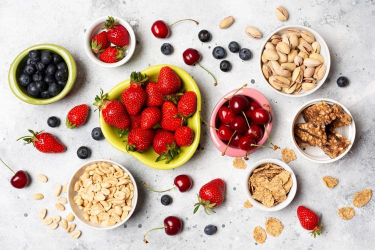 Top view healthy fruits in bowls - Foods That Help in Reducing Chronic Stress & Foods to Avoid