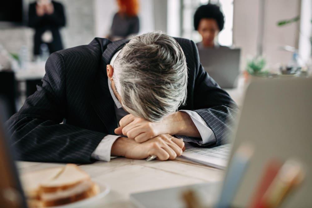 man having depression due to work